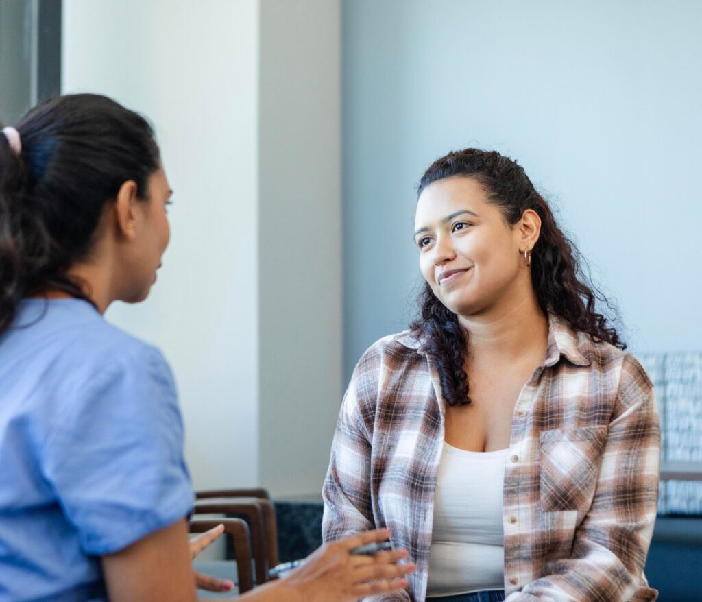 Healthcare provider speaking with patient